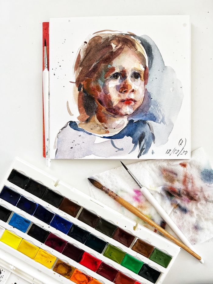 Watercolor painting of a child's portrait with a vibrant color palette.